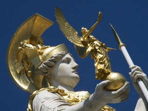 Close-up of statue of Greek Goddess Pallas Athena holding a miniature golden angel 305 x 229